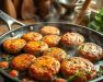 Homemade Turkey Sausage: The Perfect Breakfast Sausage Recipe 184 Juicy turkey sausage patties sizzling in a skillet, garnished with herbs and fresh vegetables